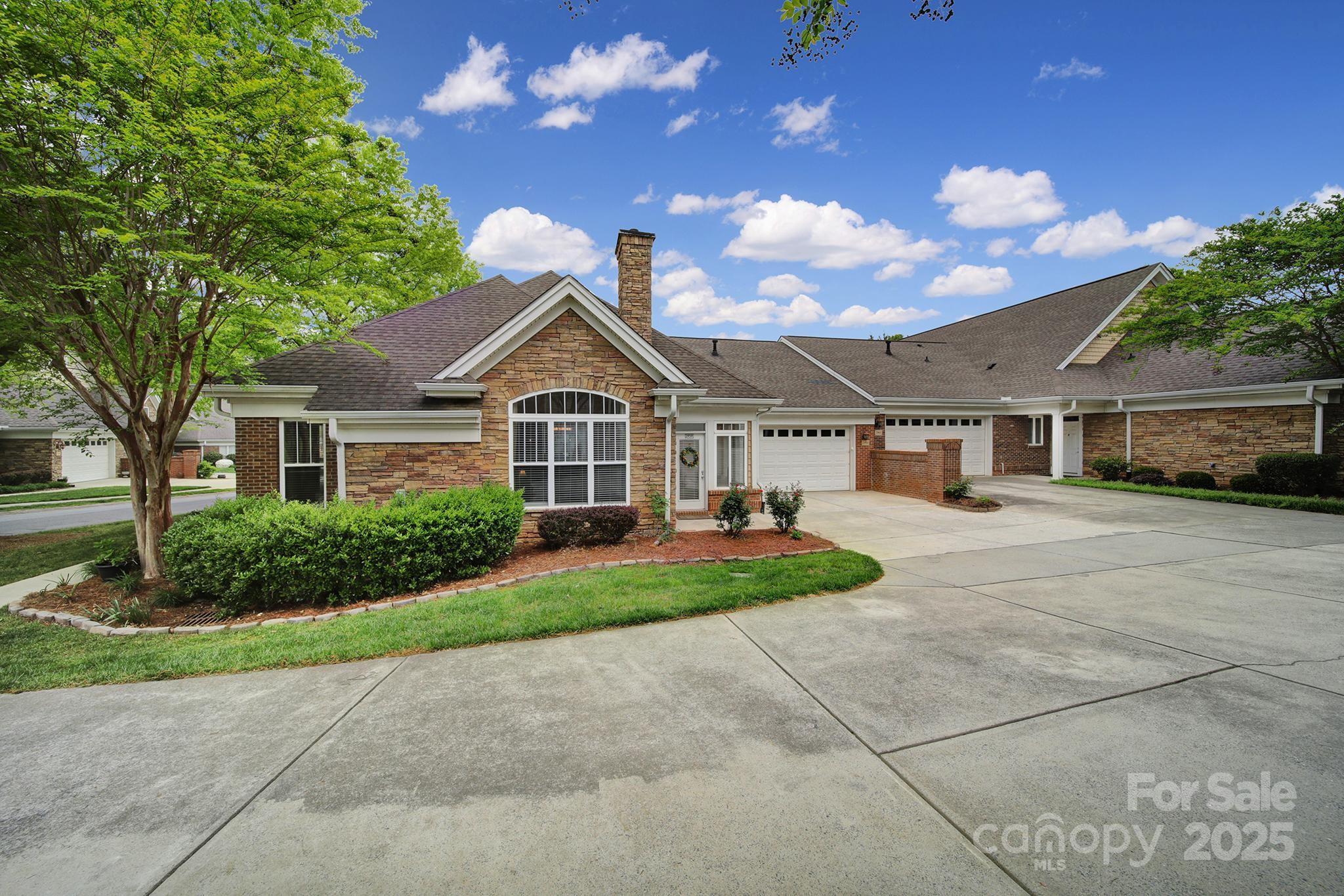 2959 Bellasera Way Matthews, NC 28105 - Photo 23 of 30 a front view of a house with garden