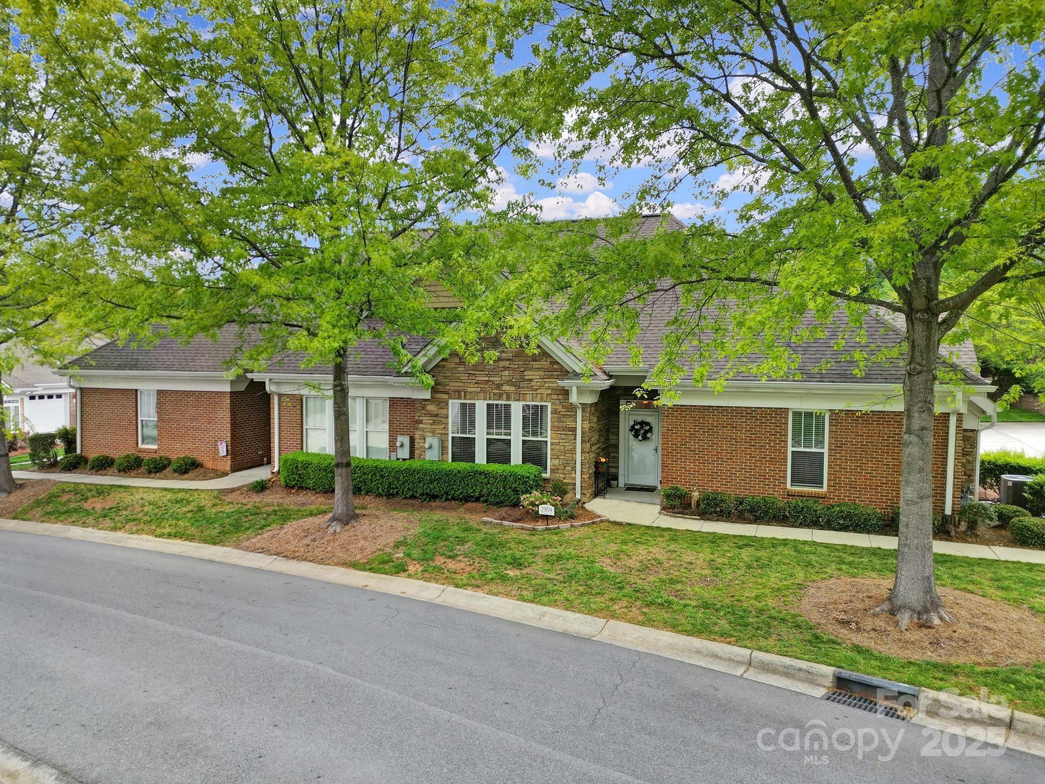2959 Bellasera Way Matthews, NC 28105 - Photo 24 of 30 a front view of house with yard and green space