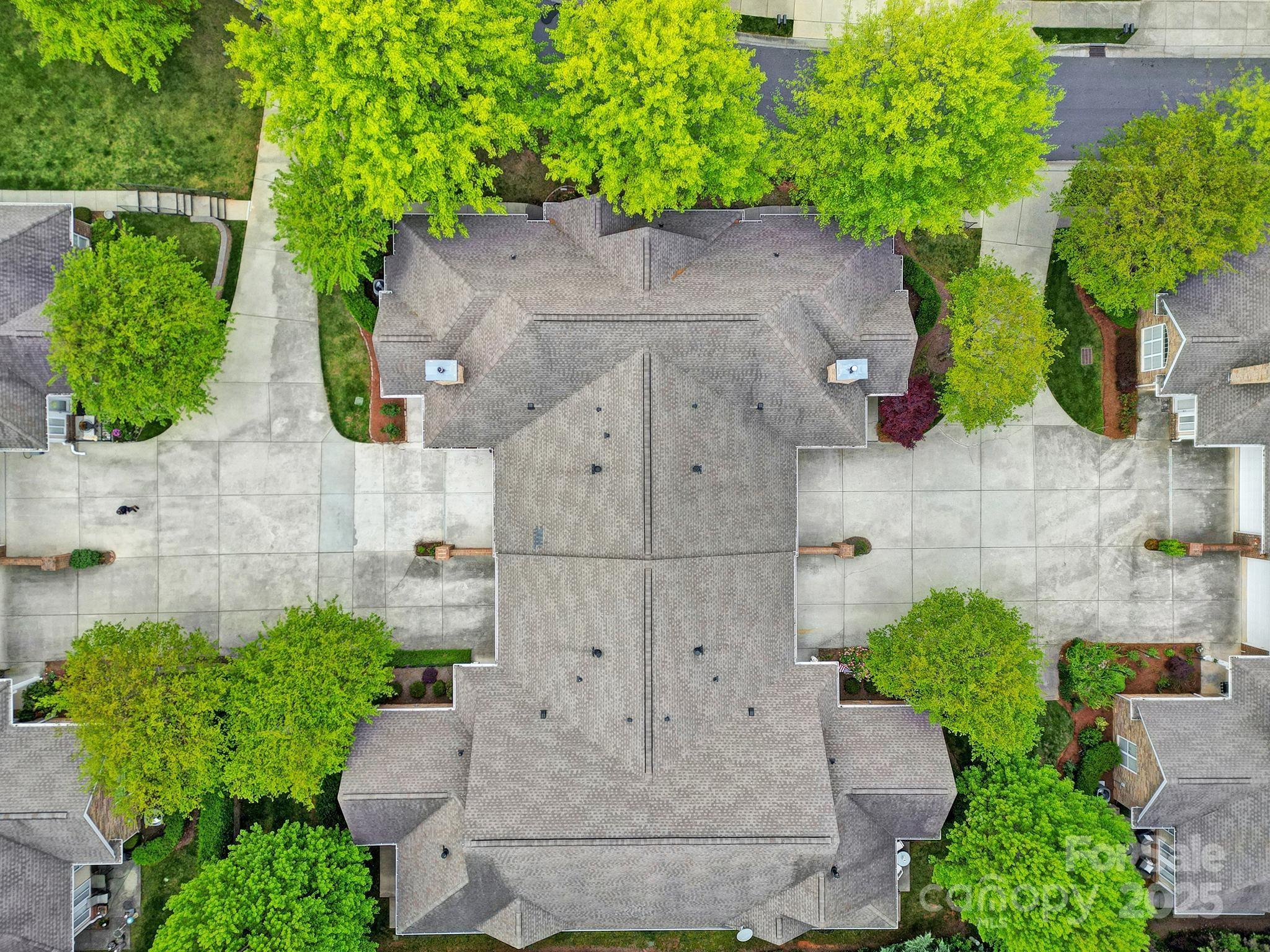 2959 Bellasera Way Matthews, NC 28105 - Photo 26 of 30 an aerial view of a house with a yard and large tree
