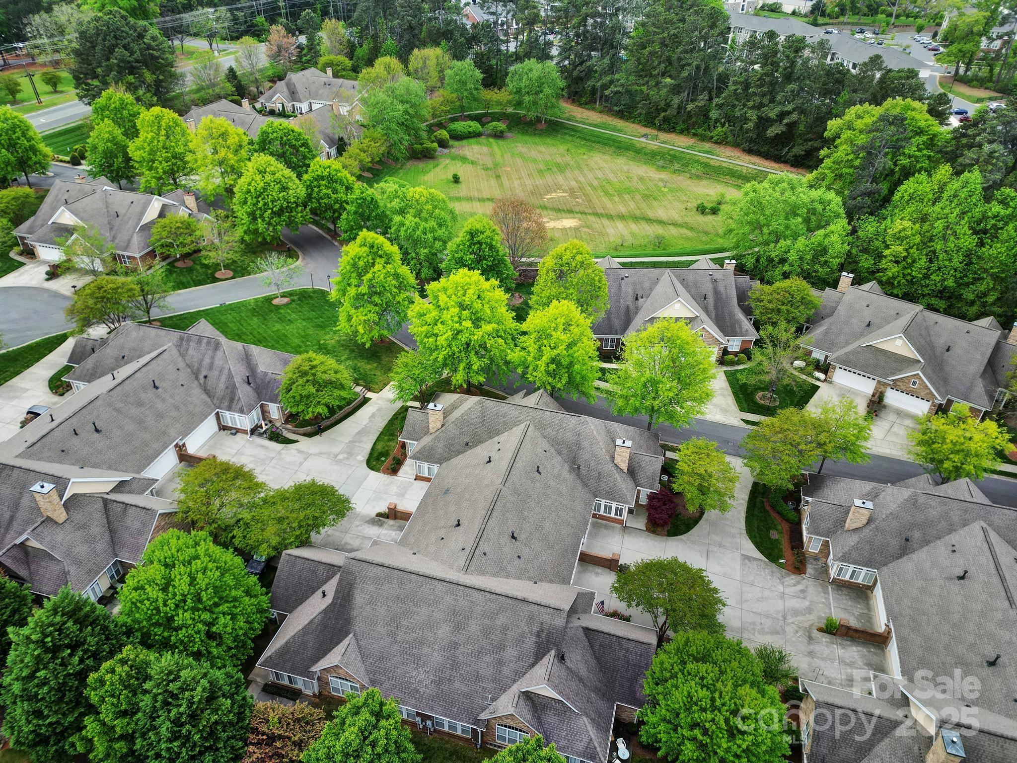 2959 Bellasera Way Matthews, NC 28105 - Photo 27 of 30 an aerial view of a house with a yard
