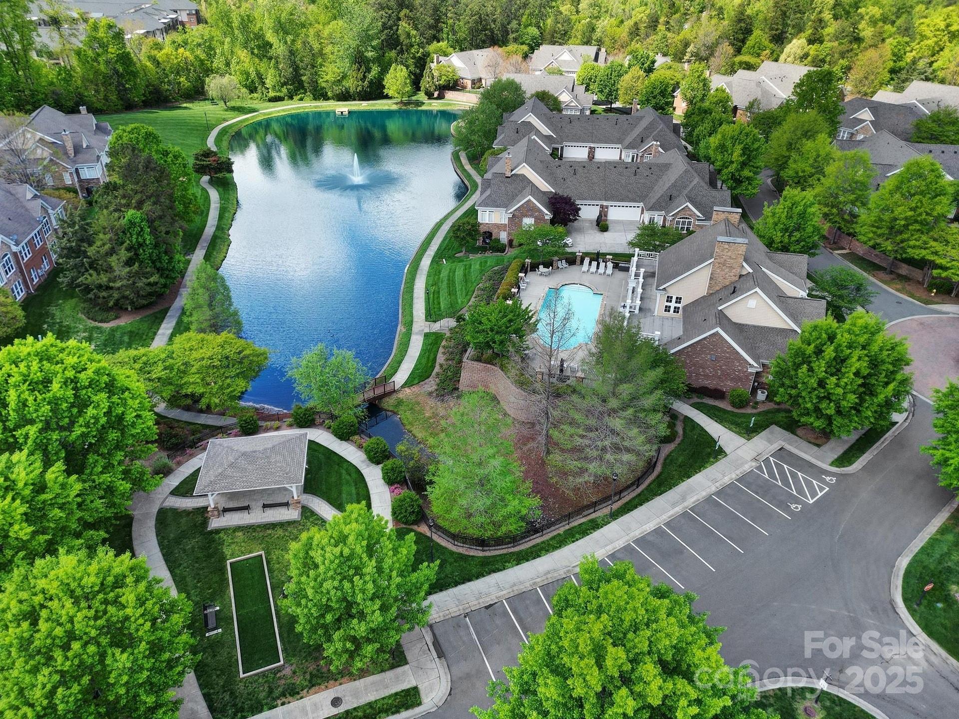 2959 Bellasera Way Matthews, NC 28105 - Photo 28 of 30 an aerial view of a house with garden space and a lake view in back