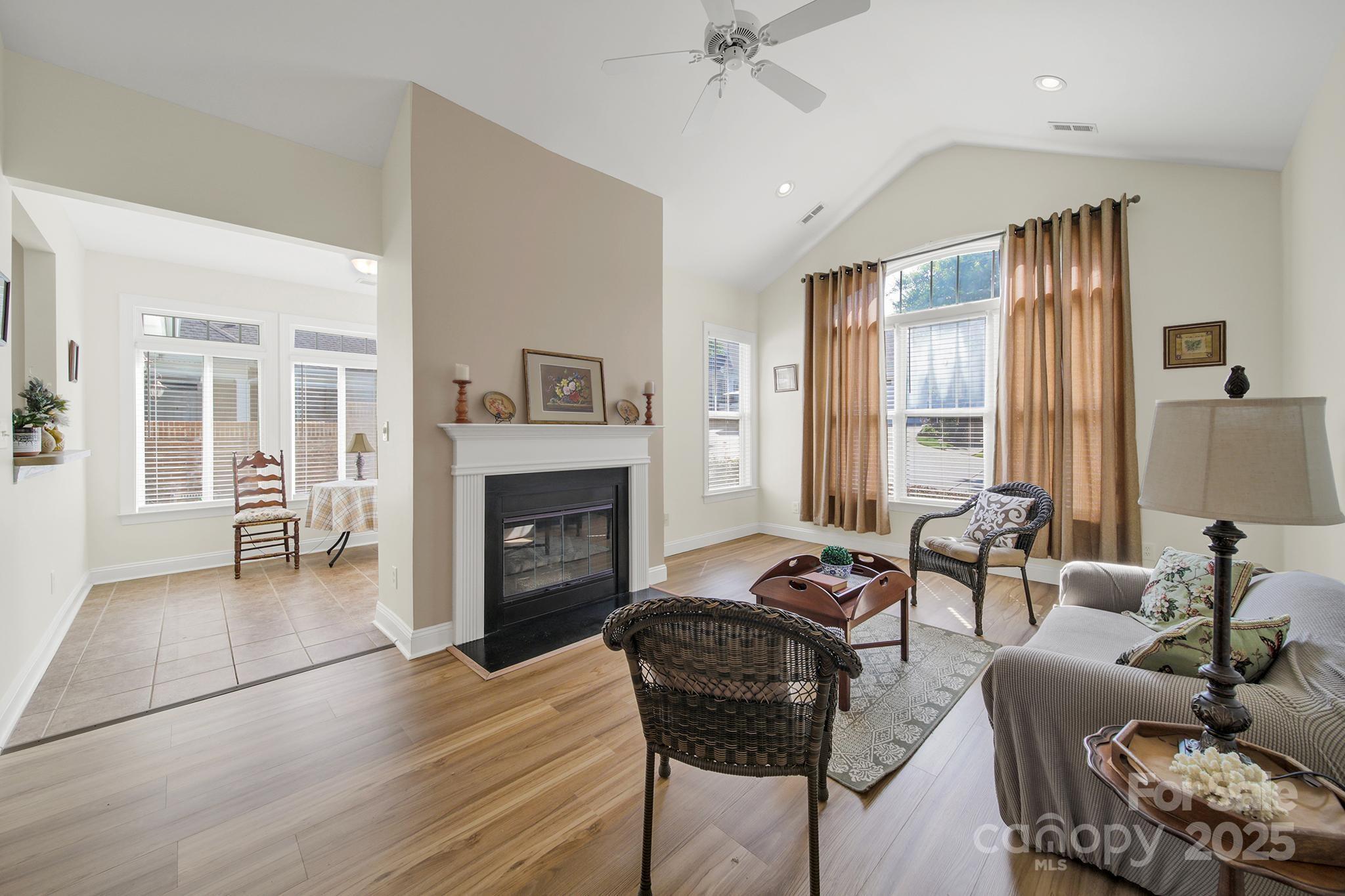 2959 Bellasera Way Matthews, NC 28105 - Photo 5 of 30 a living room with furniture and a fireplace