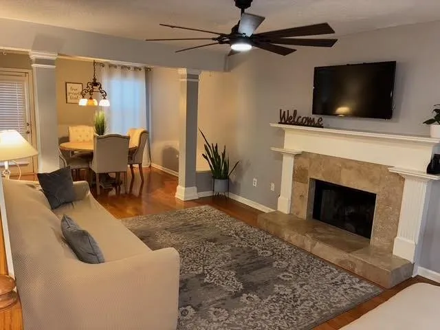 a living room with furniture and a fireplace