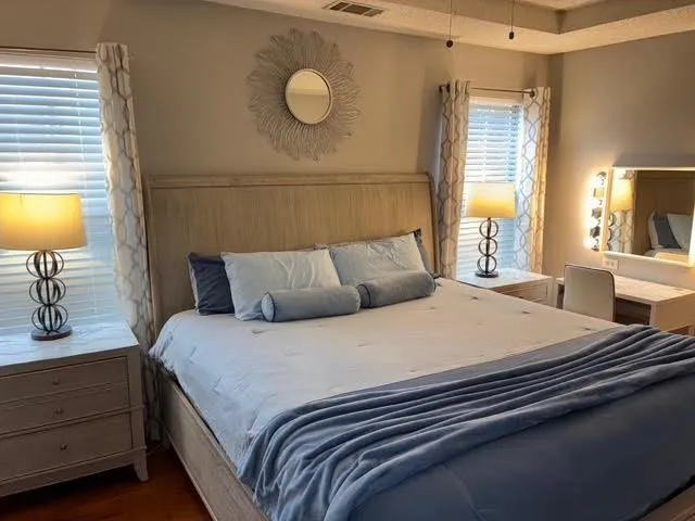 a bedroom with bed and window