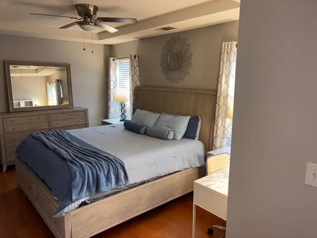 a bedroom with a bed and window