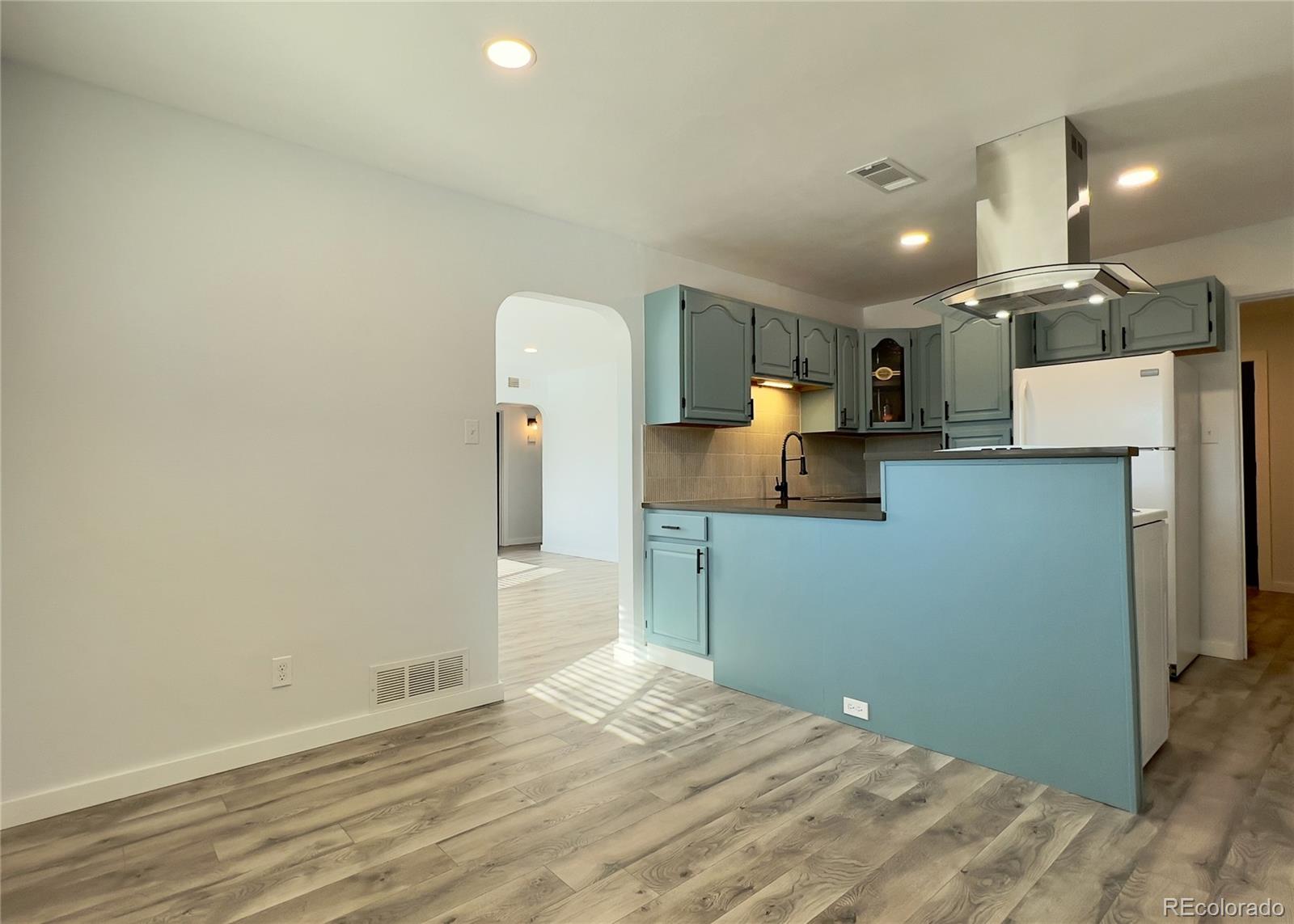 9190 High Street Thornton, CO 80229 - Photo 11 of 28 a kitchen with granite countertop cabinets and refrigerator