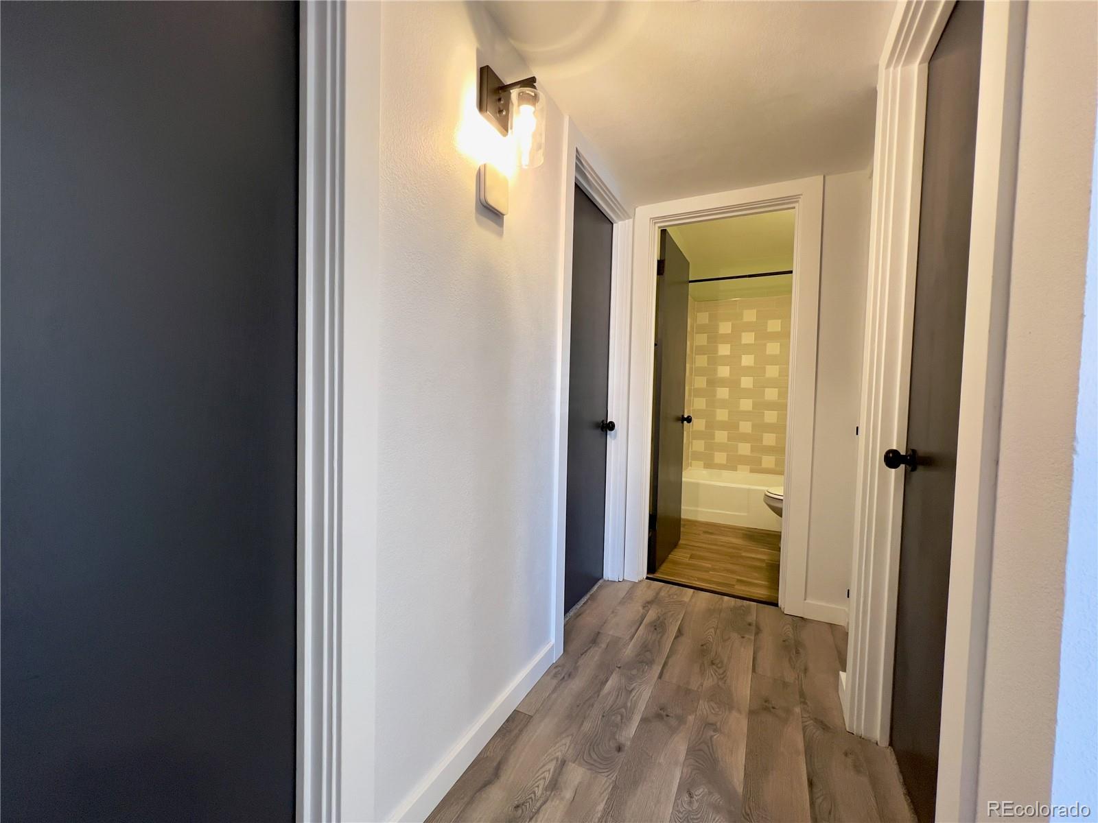9190 High Street Thornton, CO 80229 - Photo 13 of 28 a view of a bathroom from a hallway