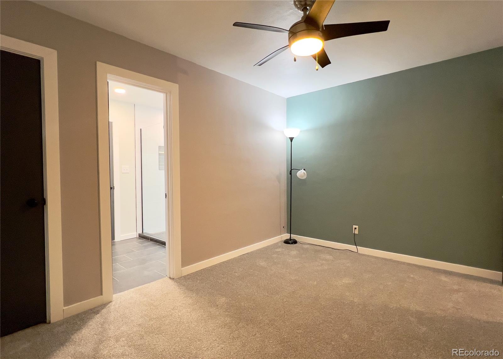 9190 High Street Thornton, CO 80229 - Photo 14 of 28 an empty room with closet and fan