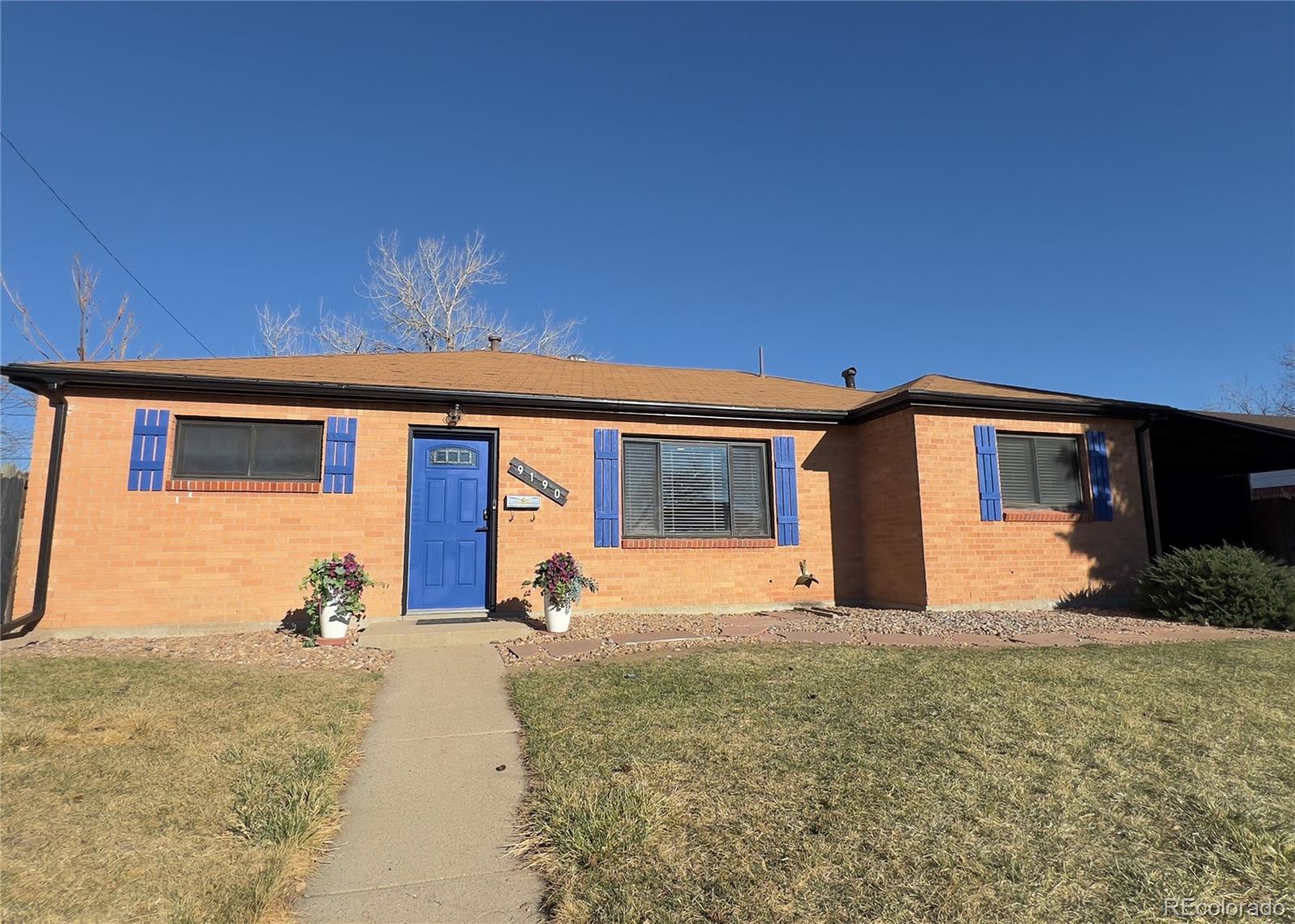 9190 High Street Thornton, CO 80229 - Photo 2 of 28 a front view of house with yard