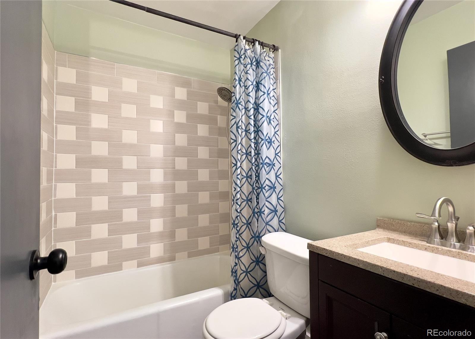 9190 High Street Thornton, CO 80229 - Photo 26 of 28 a bathroom with a sink toilet and shower