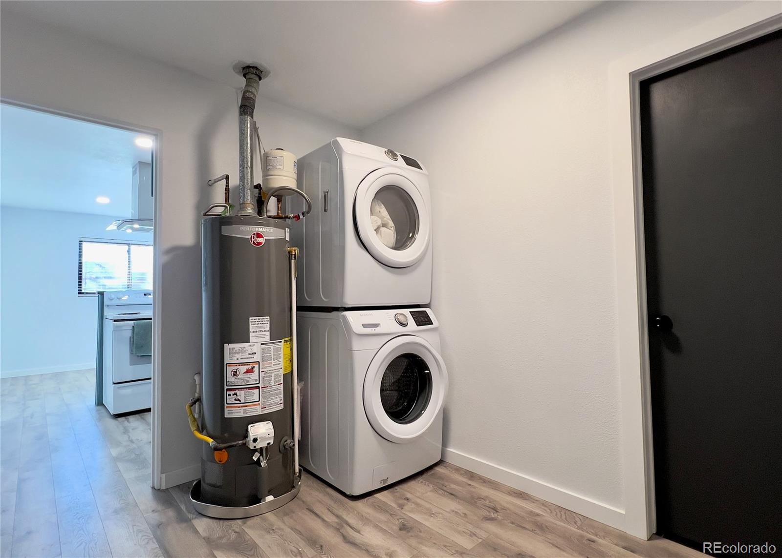 9190 High Street Thornton, CO 80229 - Photo 27 of 28 a view of a storage & utility room with washer and dryer