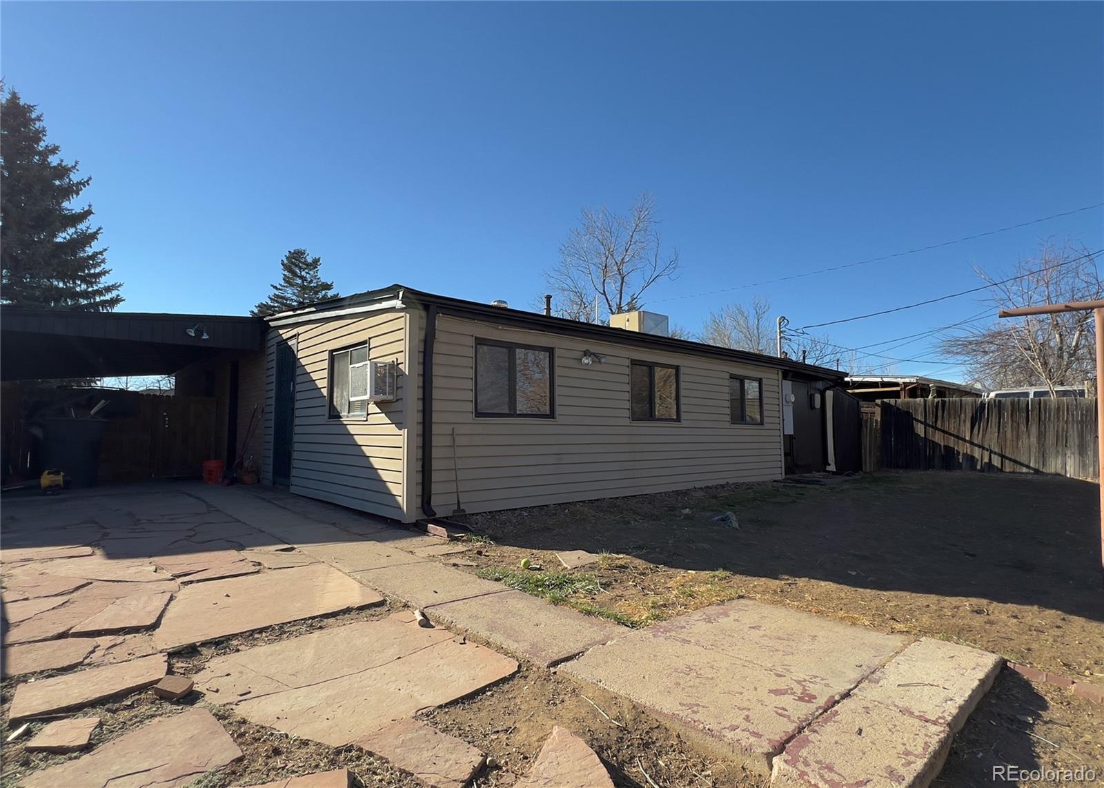 9190 High Street Thornton, CO 80229 - Photo 28 of 28 a front view of a house with a yard