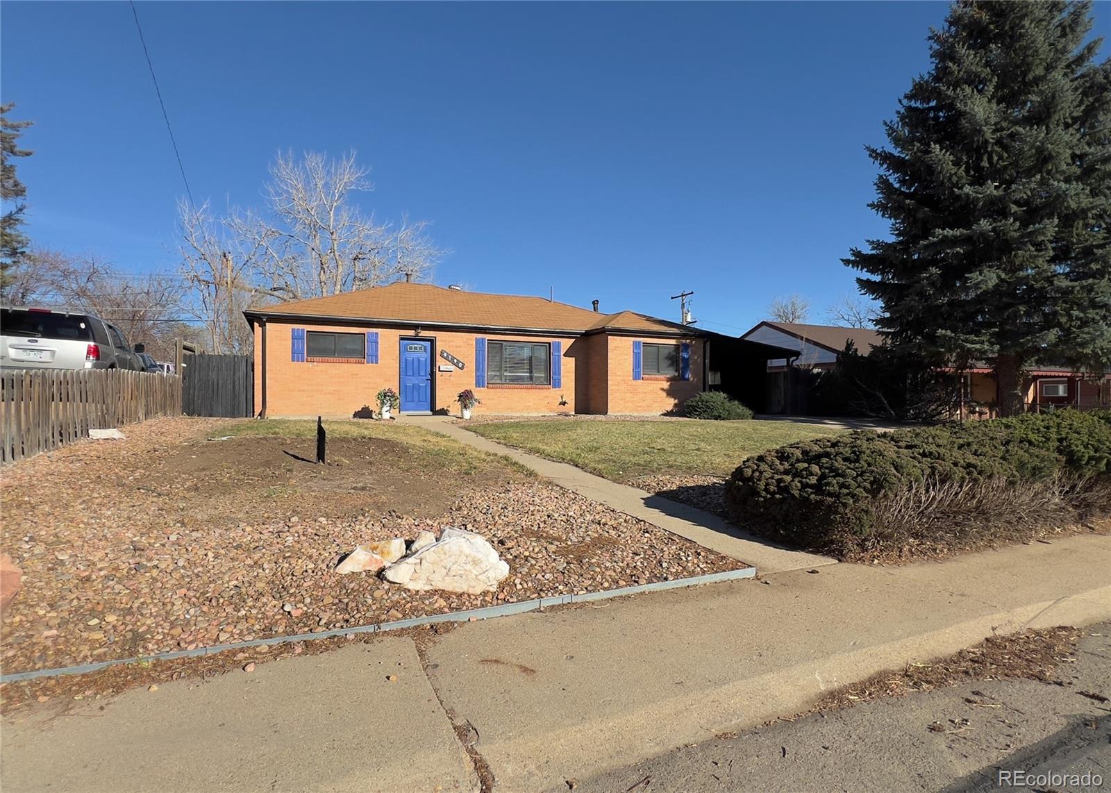 9190 High Street Thornton, CO 80229 - Photo 3 of 28 a view of a house with a snow in the yard