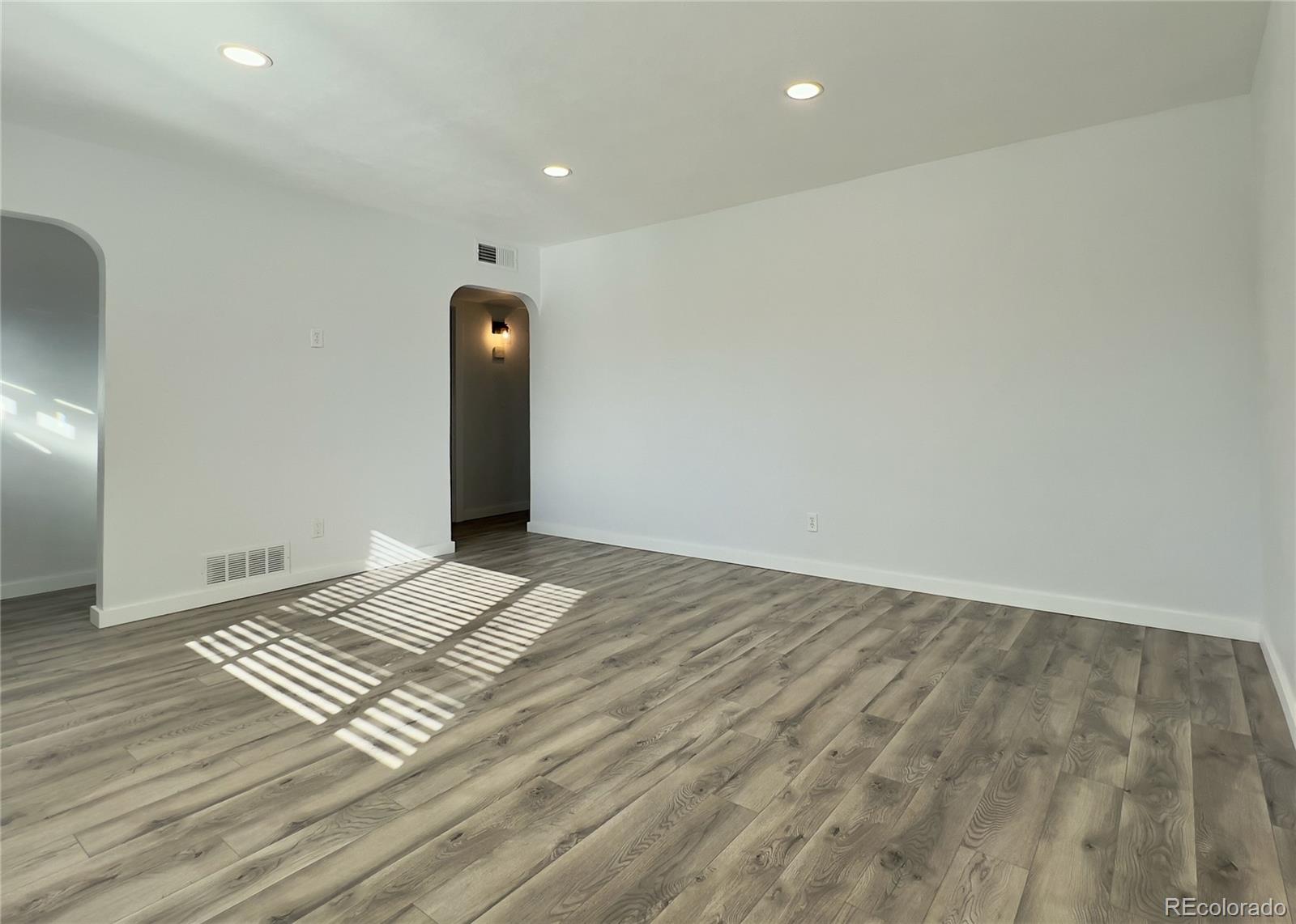 9190 High Street Thornton, CO 80229 - Photo 5 of 28 a view of a room with wooden floor and staircase