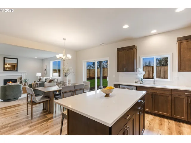 a kitchen with a counter top space a sink cabinets and appliances
