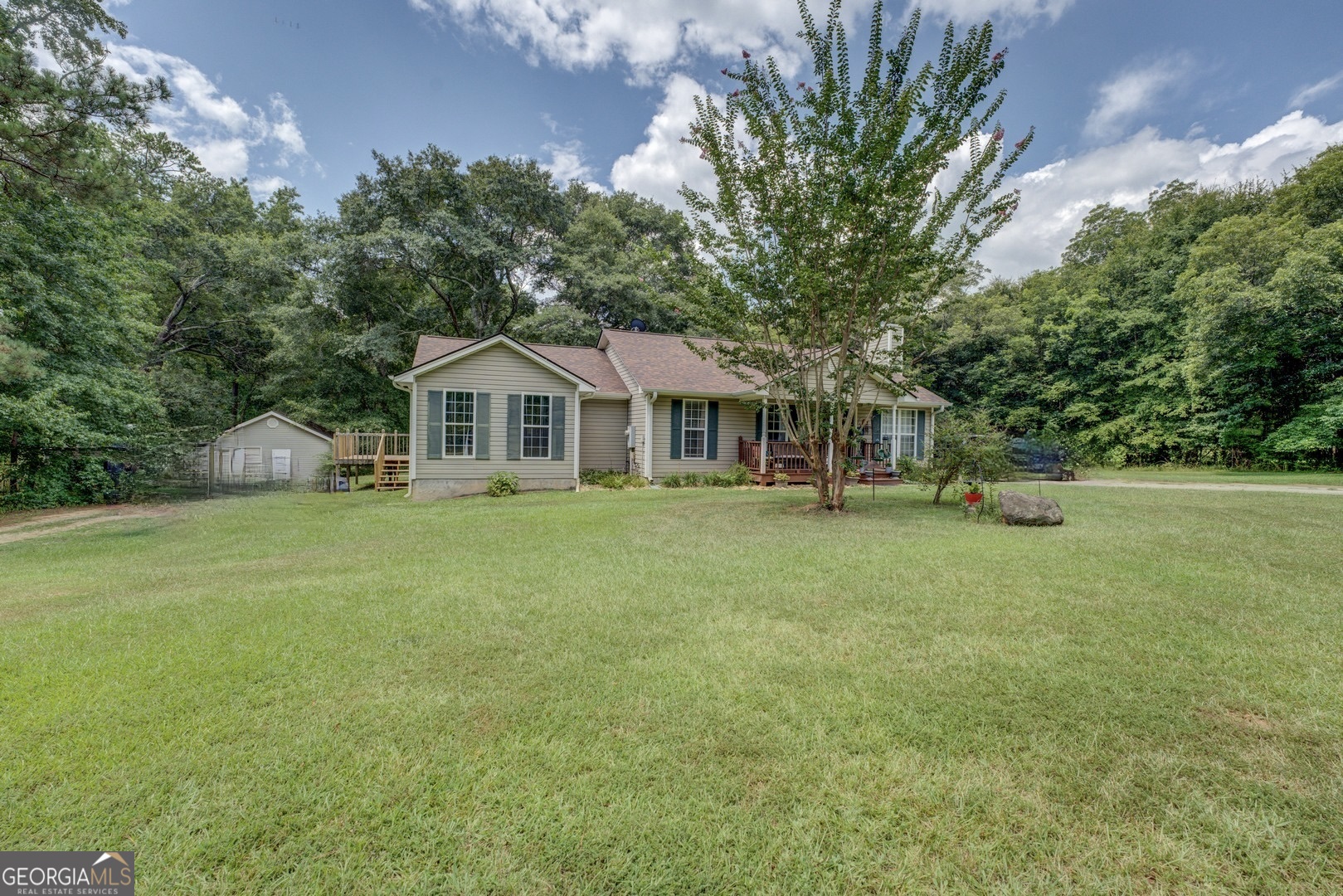 118 Wildwood Road Jackson, GA 30233 - Photo 1 of 1 a front view of a house with a garden