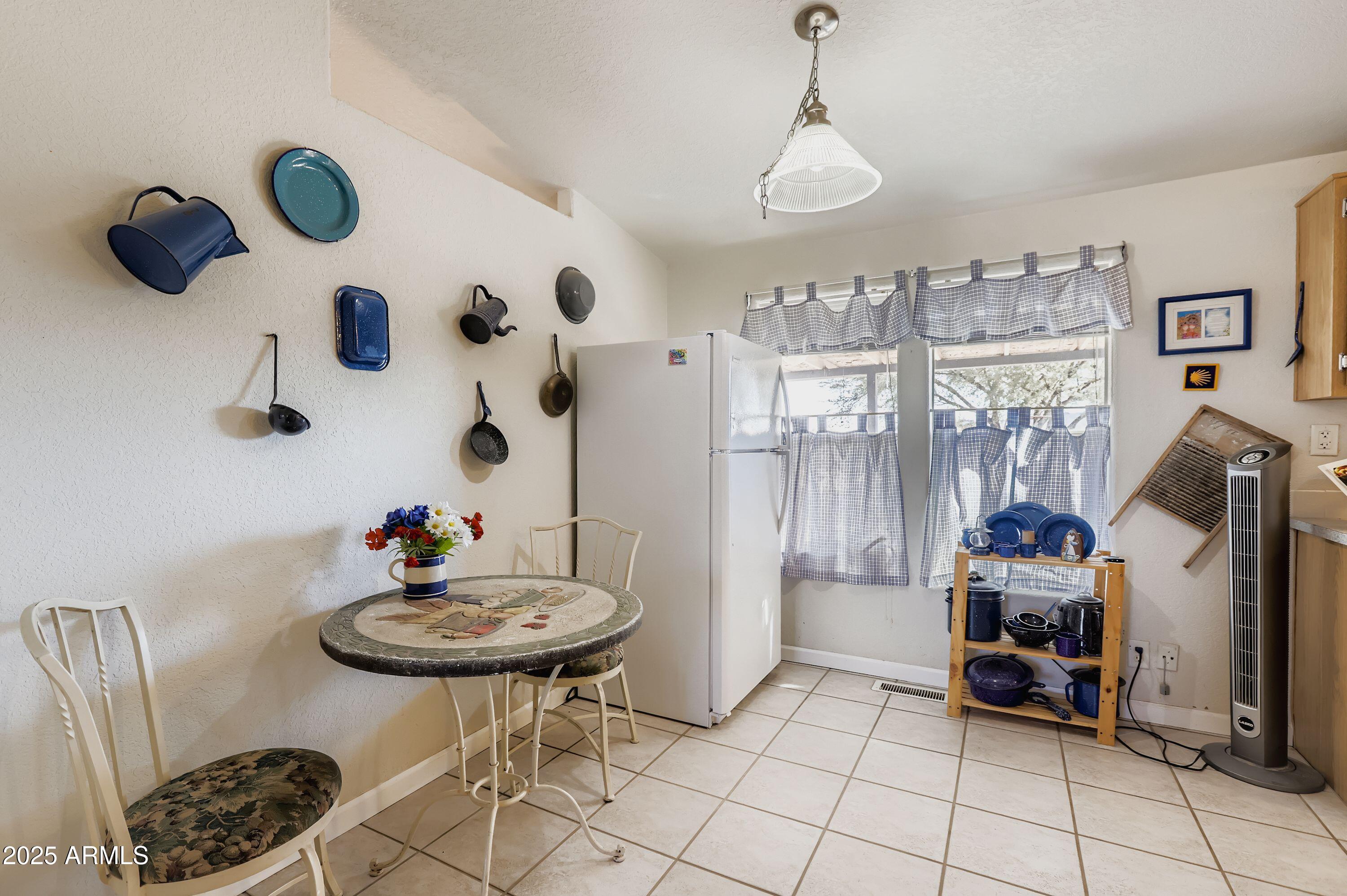 20607 West Chandler Heights Road Buckeye, AZ 85326 - Photo 13 of 29 a bedroom with furniture and a chandelier