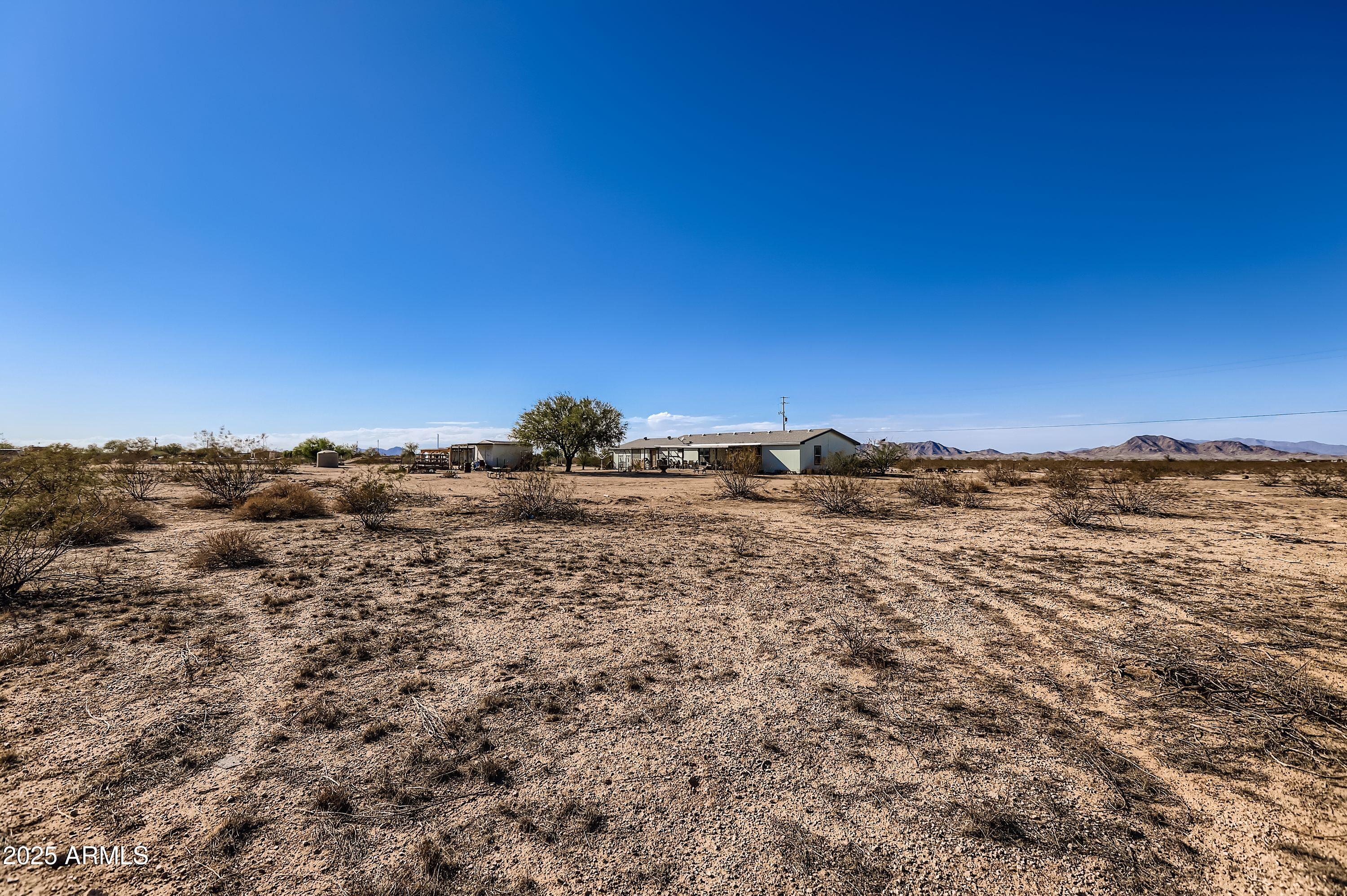 20607 West Chandler Heights Road Buckeye, AZ 85326 - Photo 26 of 29 a view of houses with sky view