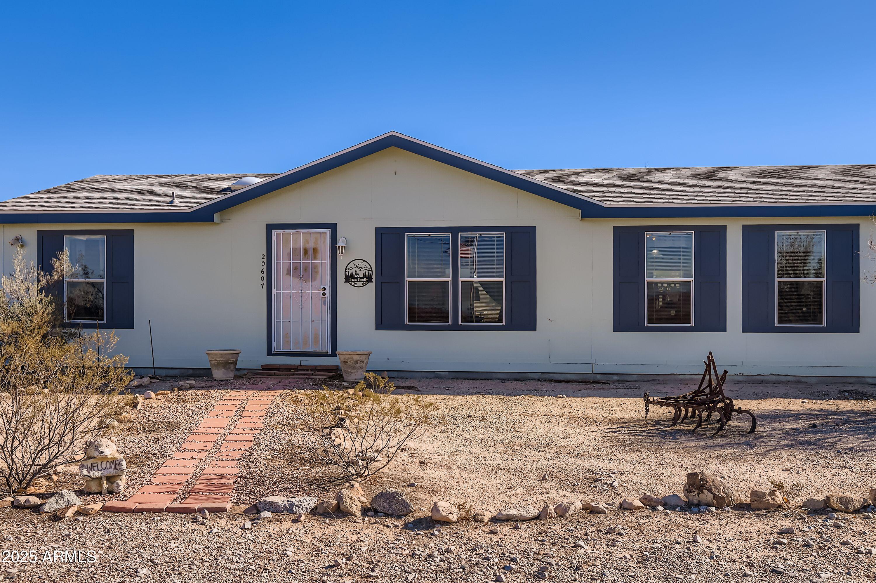 20607 West Chandler Heights Road Buckeye, AZ 85326 - Photo 28 of 29 a house with yard in front of it