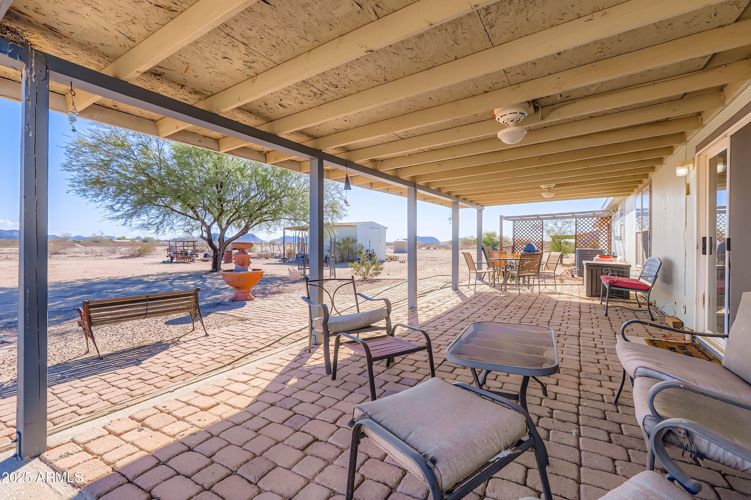 20607 West Chandler Heights Road Buckeye, AZ 85326 - Photo 5 of 29 a outdoor space with chairs