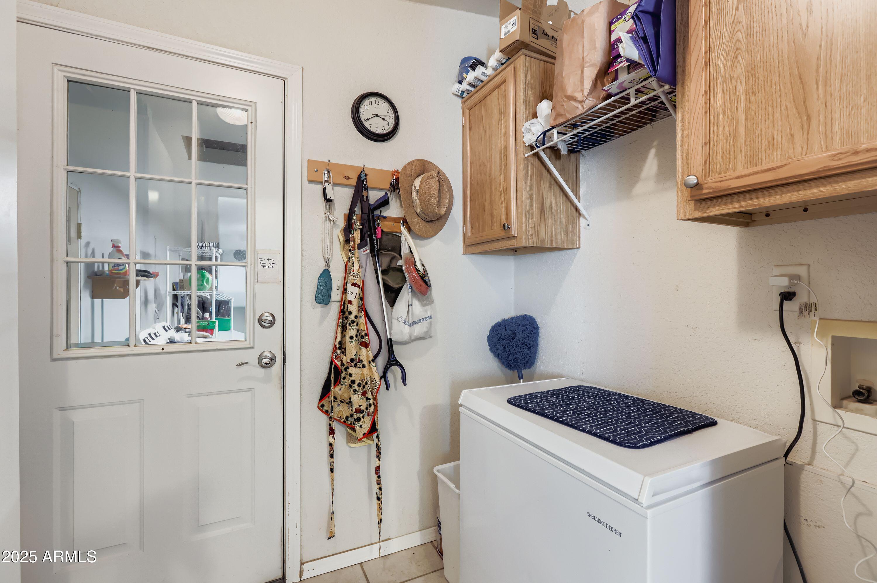 20607 West Chandler Heights Road Buckeye, AZ 85326 - Photo 8 of 29 a view of storage and utility room with washer and dryer