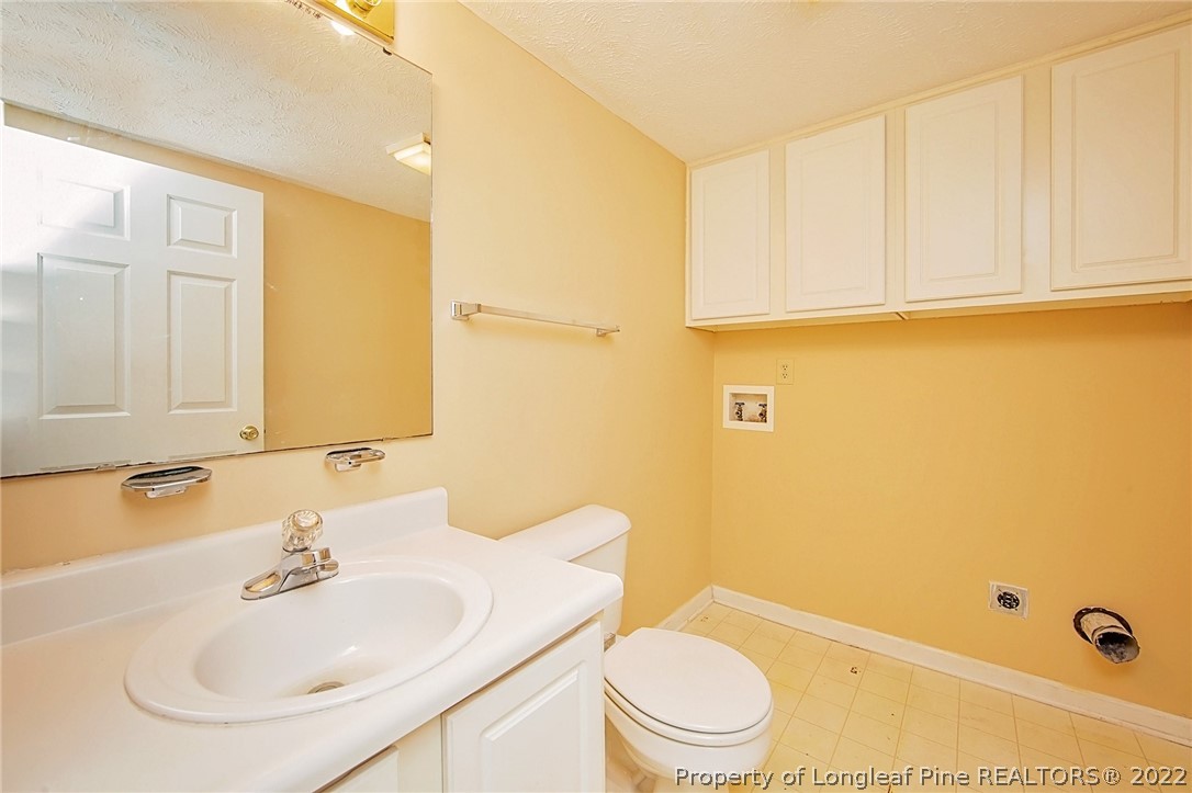 138 Pecan Trace Road Raeford, NC 28376 - Photo 19 of 42 a bathroom with a sink a toilet and shower
