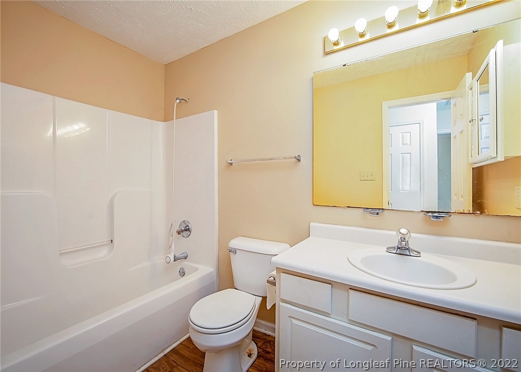 138 Pecan Trace Road Raeford, NC 28376 - Photo 30 of 42 a bathroom with a sink toilet and shower