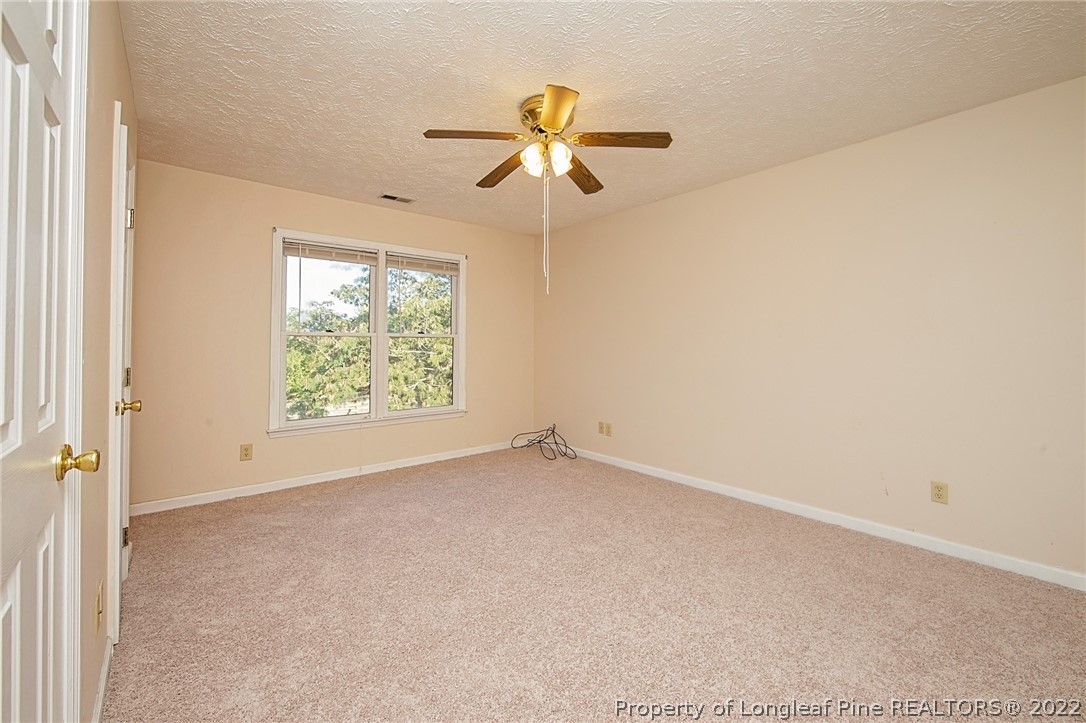 138 Pecan Trace Road Raeford, NC 28376 - Photo 32 of 42 a view of an empty room with a window