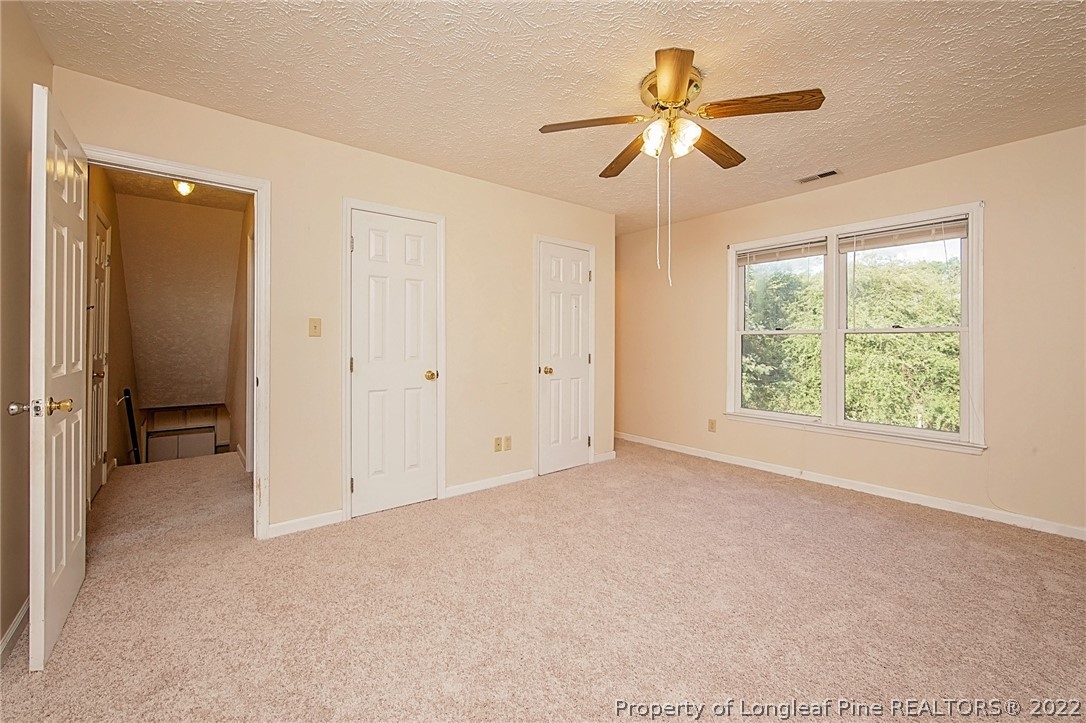 138 Pecan Trace Road Raeford, NC 28376 - Photo 33 of 42 an empty room with fan and windows
