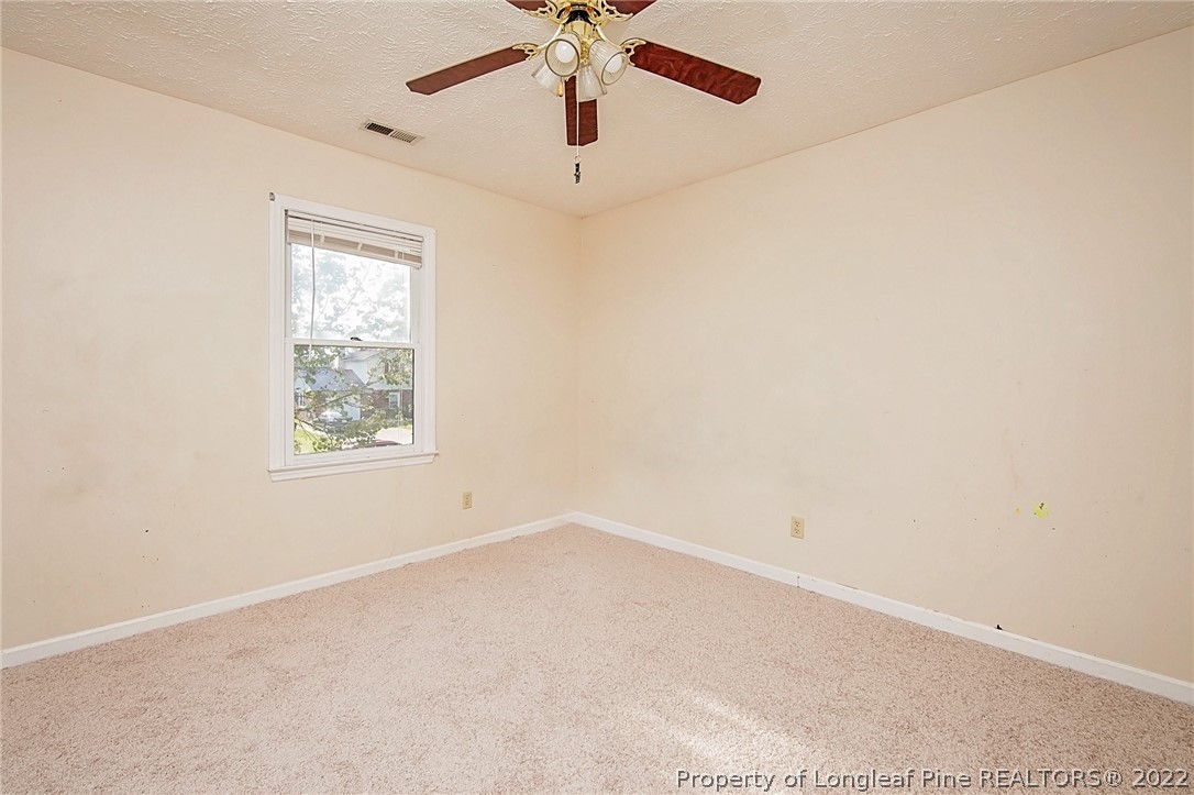 138 Pecan Trace Road Raeford, NC 28376 - Photo 39 of 42 an empty room with windows and fan