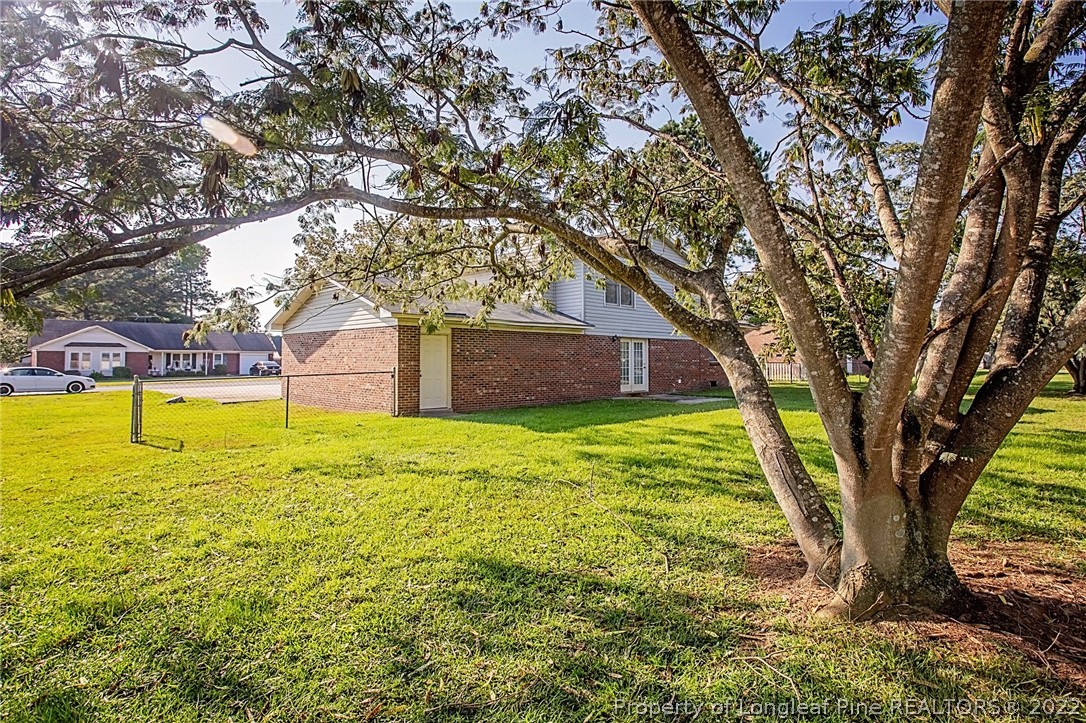 138 Pecan Trace Road Raeford, NC 28376 - Photo 4 of 42 a large tree in the garden of a house