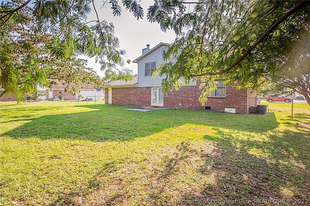138 Pecan Trace Road Raeford, NC 28376 - Photo 5 of 42 a view of a house with a yard and a tree