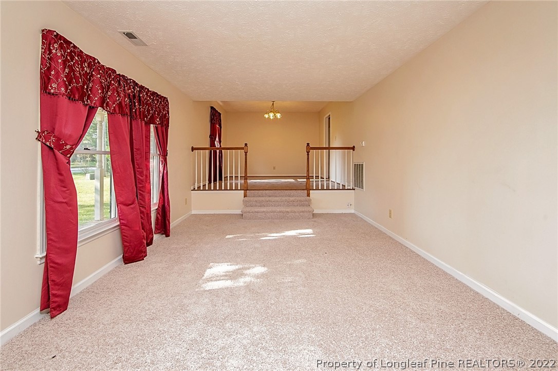 138 Pecan Trace Road Raeford, NC 28376 - Photo 7 of 42 a view of walk in closet with clothes and shoes