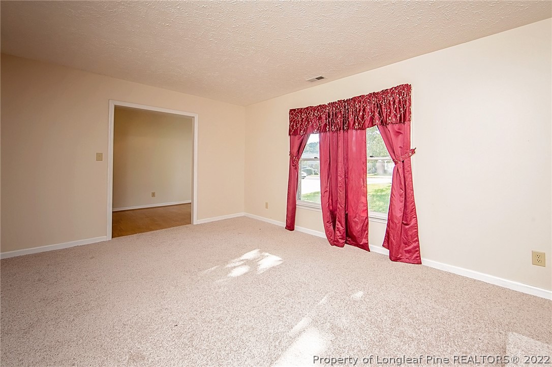 138 Pecan Trace Road Raeford, NC 28376 - Photo 9 of 42 a view of a room with window and closet