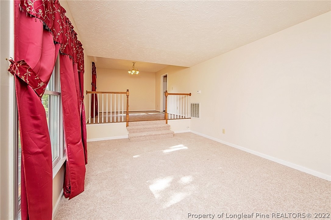 138 Pecan Trace Road Raeford, NC 28376 - Photo 10 of 42 a view of walk in closet with clothes