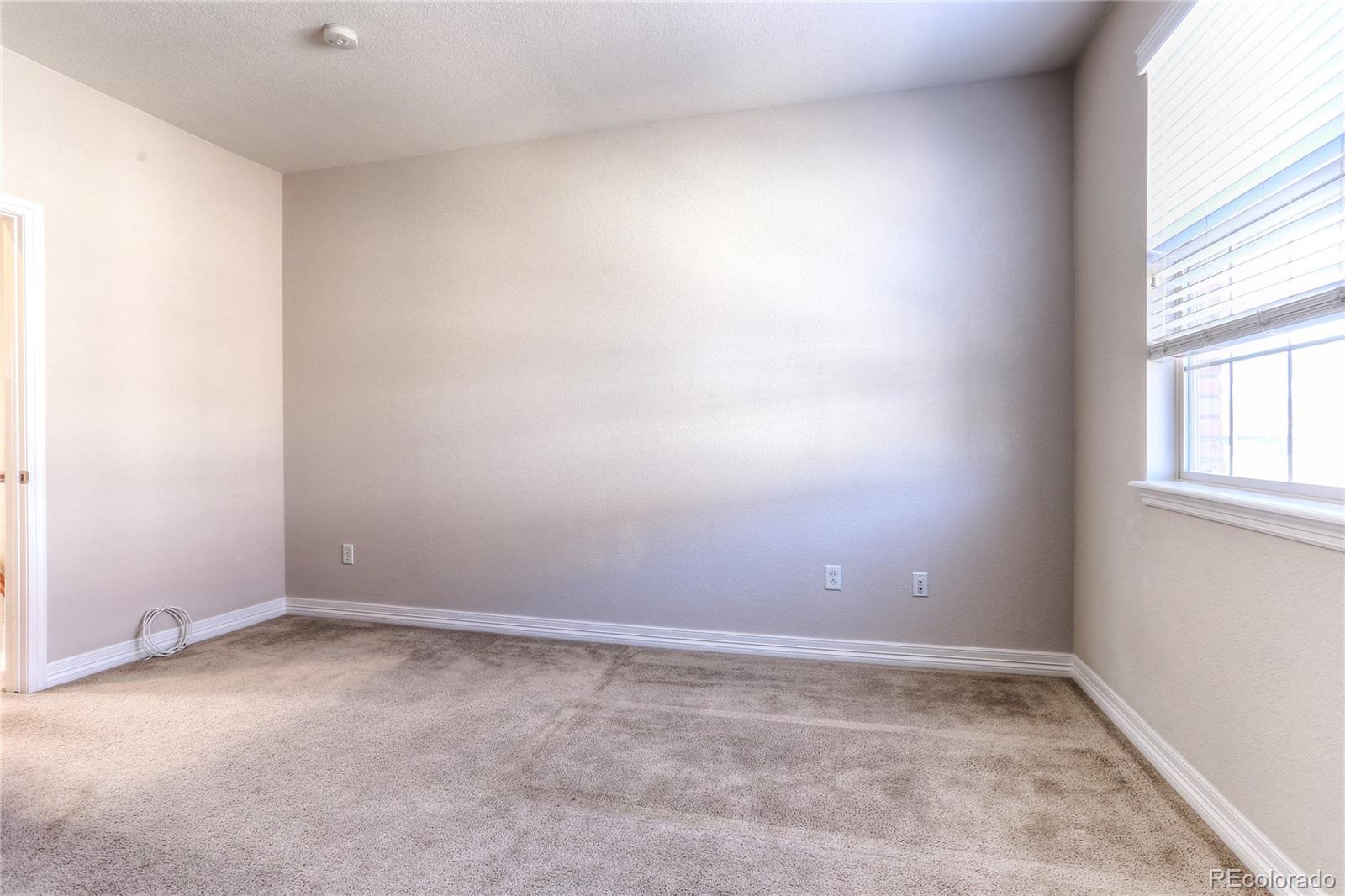 10178 RidgeGate Circle Lone Tree, CO 80124 - Photo 17 of 22 an empty room with a window