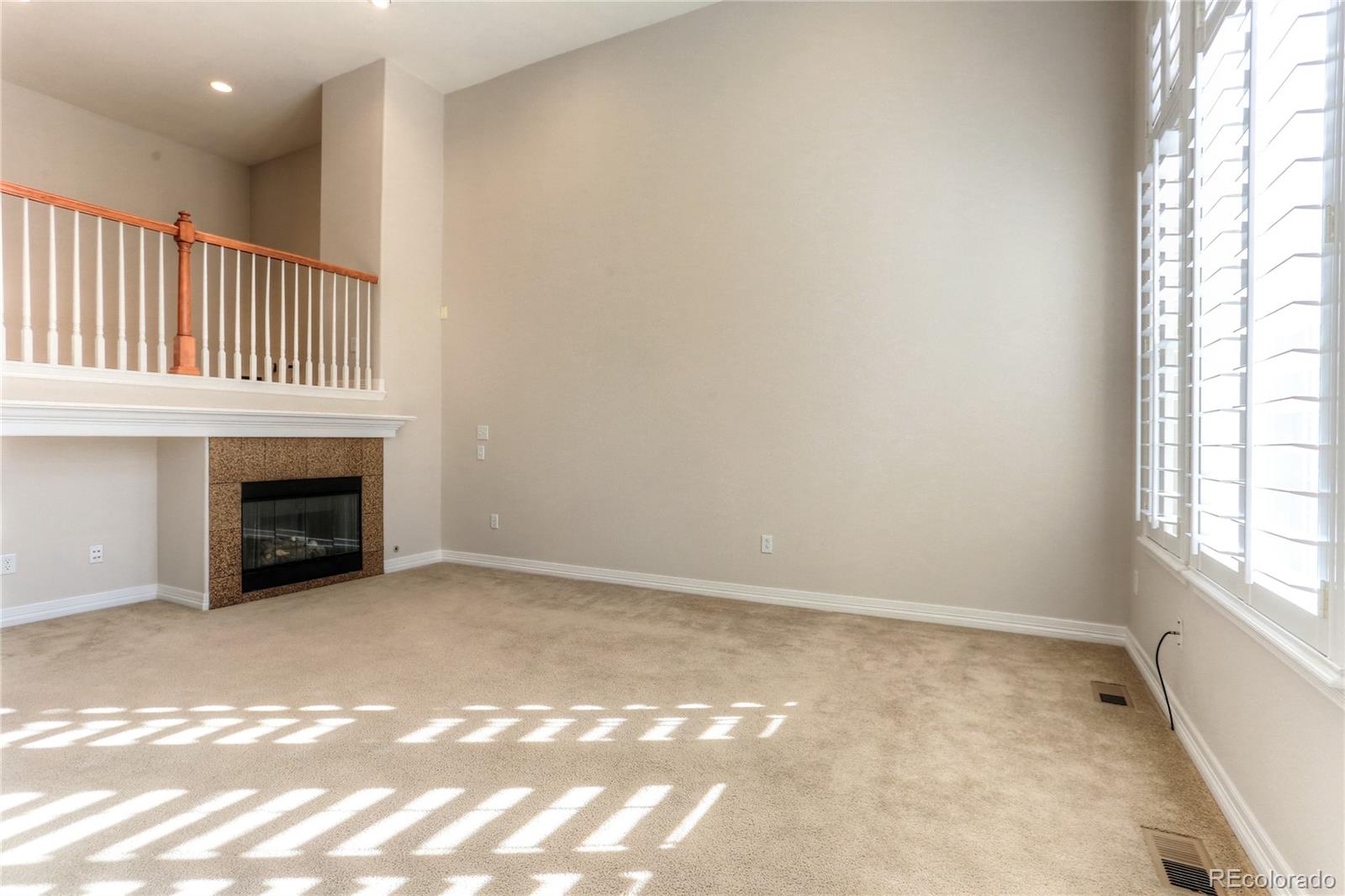 10178 RidgeGate Circle Lone Tree, CO 80124 - Photo 4 of 22 a view of an empty room with a window