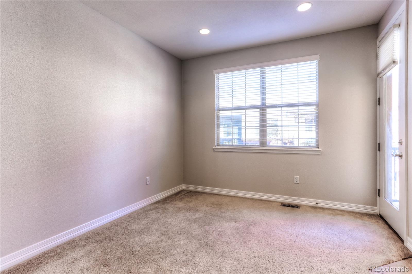 10178 RidgeGate Circle Lone Tree, CO 80124 - Photo 9 of 22 an empty room with a window
