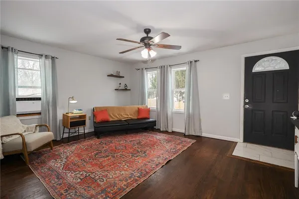 a bedroom with bed and wooden floor