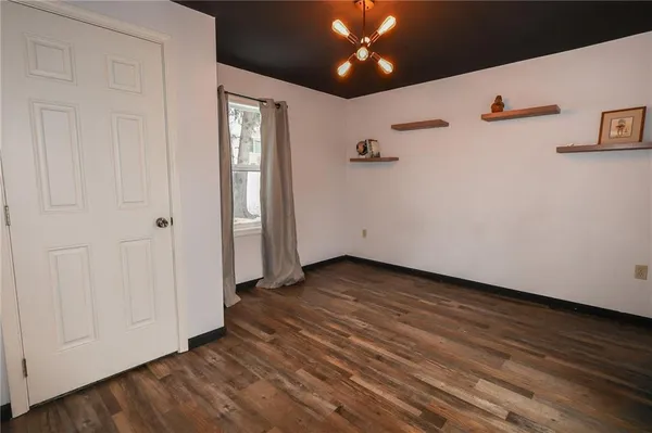 a view of a livingroom with wooden floor