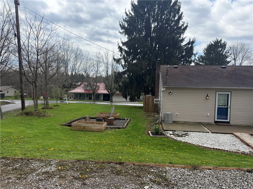 125 Church Road Slippery Rock, PA 16057 - Photo 30 of 35 a backyard of a house with lots of green space
