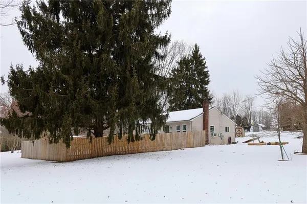 a view of a backyard of the house