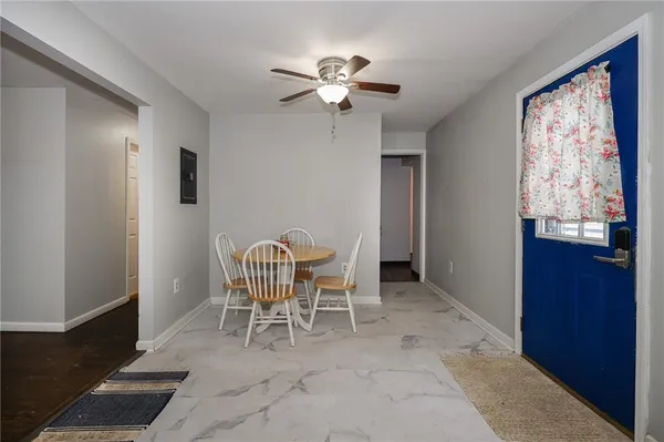 a dining room with furniture and chandelier