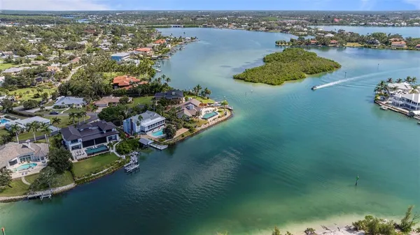 an aerial view of a house with a lake view