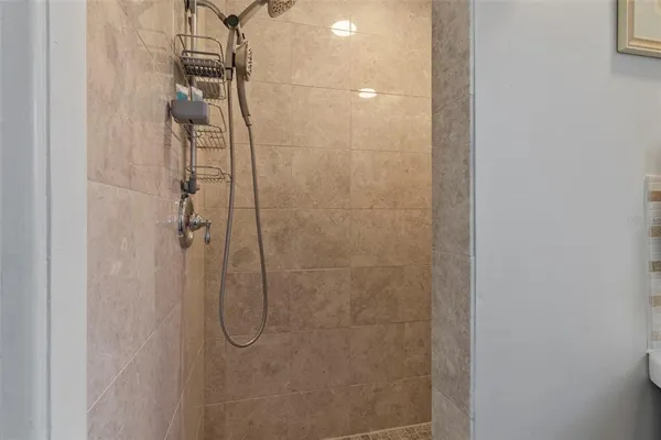 a bathroom with a glass shower door