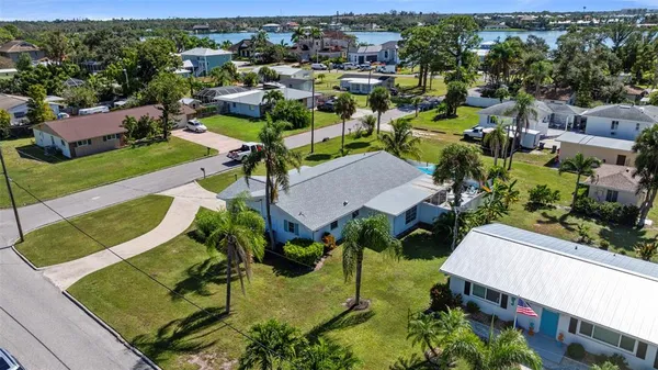 an aerial view of multiple houses with yard