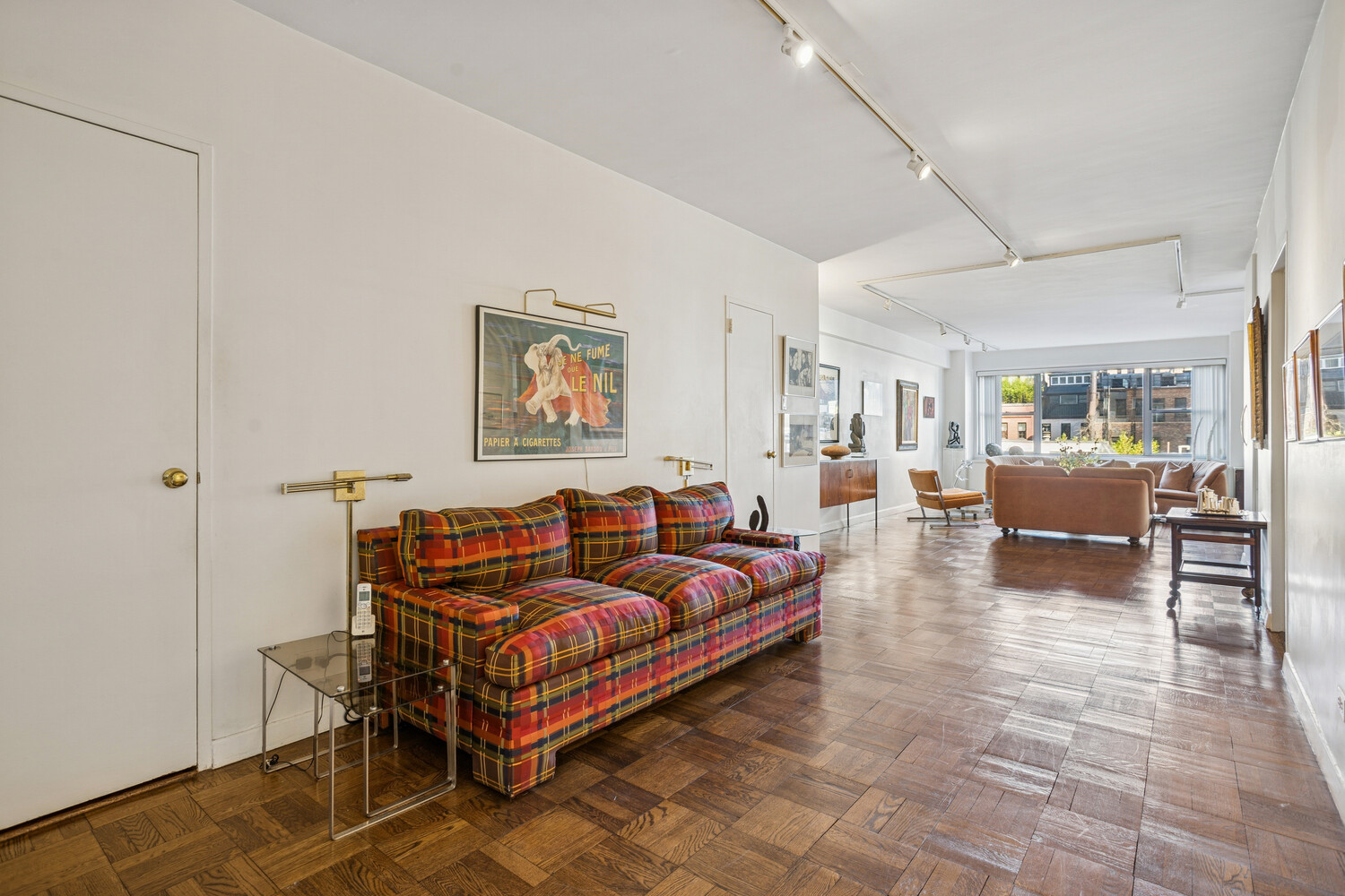 a living room with furniture and a table