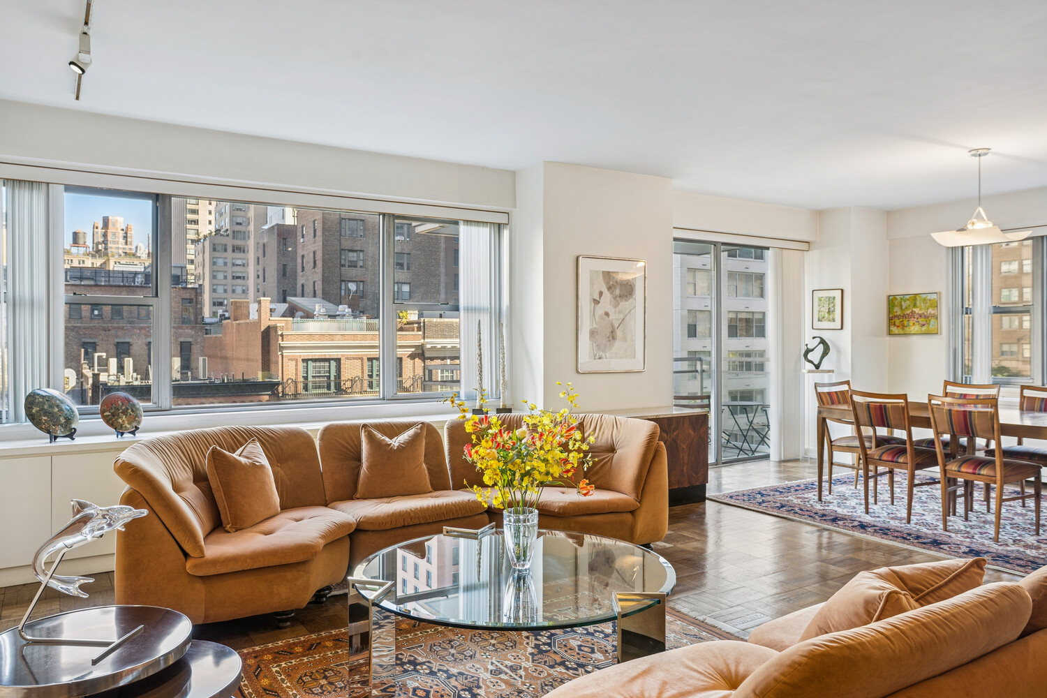 150 East 69th Street, Unit 5J Manhattan, NY 10021 - Photo 3 of 11 a living room with furniture and a table