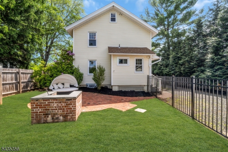 105 Somerville Road Bedminster, NJ 07921 - Photo 26 of 36 a view of a house with backyard and a garden