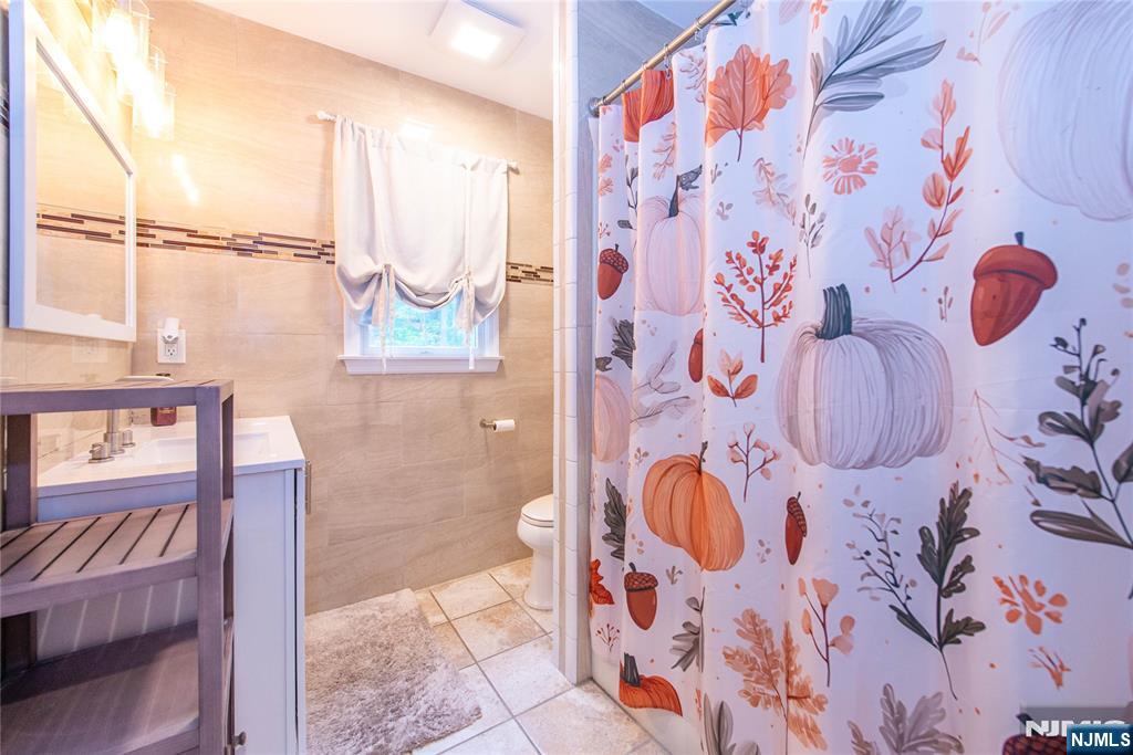 5 Mountain Avenue, Unit 2 Wanaque, NJ 07465 - Photo 12 of 20 a bathroom with a bathtub and shower